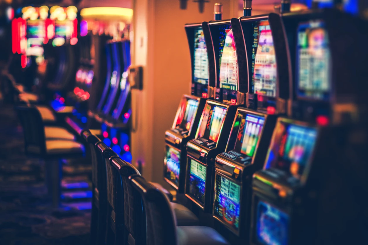 Rows of Casino Slot Machines with Shallow Depth of Field. Las Vegas Gambling Theme.