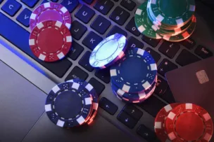 An image of poker chips falling on a keyboard