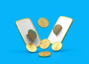 Two smartphones with gold frames surrounded by floating gold coins featuring dollar signs, set against a bright blue background, symbolizing digital transactions or mobile payments.