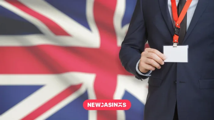 London Gaming Congress Unites Industry Titans to Shape the Future of Gaming A person with a lanyard on, in front of a Union Jack flag.