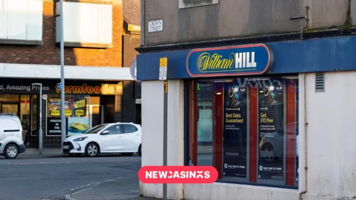 Evoke Eyes Mass Shop Closures As UK Betting Tax Hike Looms Exterior William Hill betting shop in a high street. The New Casinos logo in the foreground.